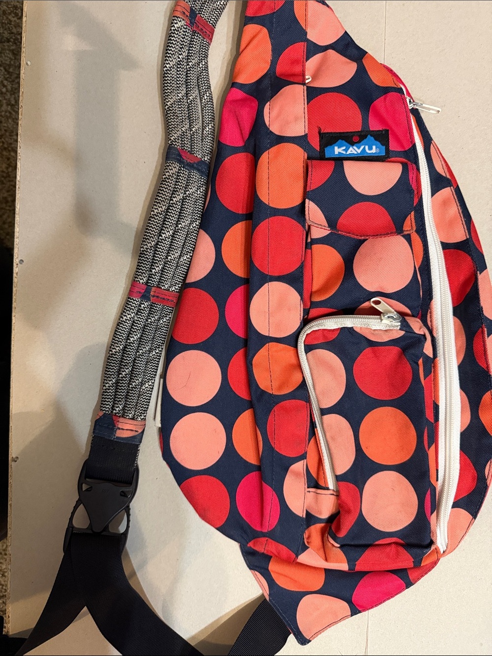 Kavu Navy Sling Bag with Coral and Red Dots